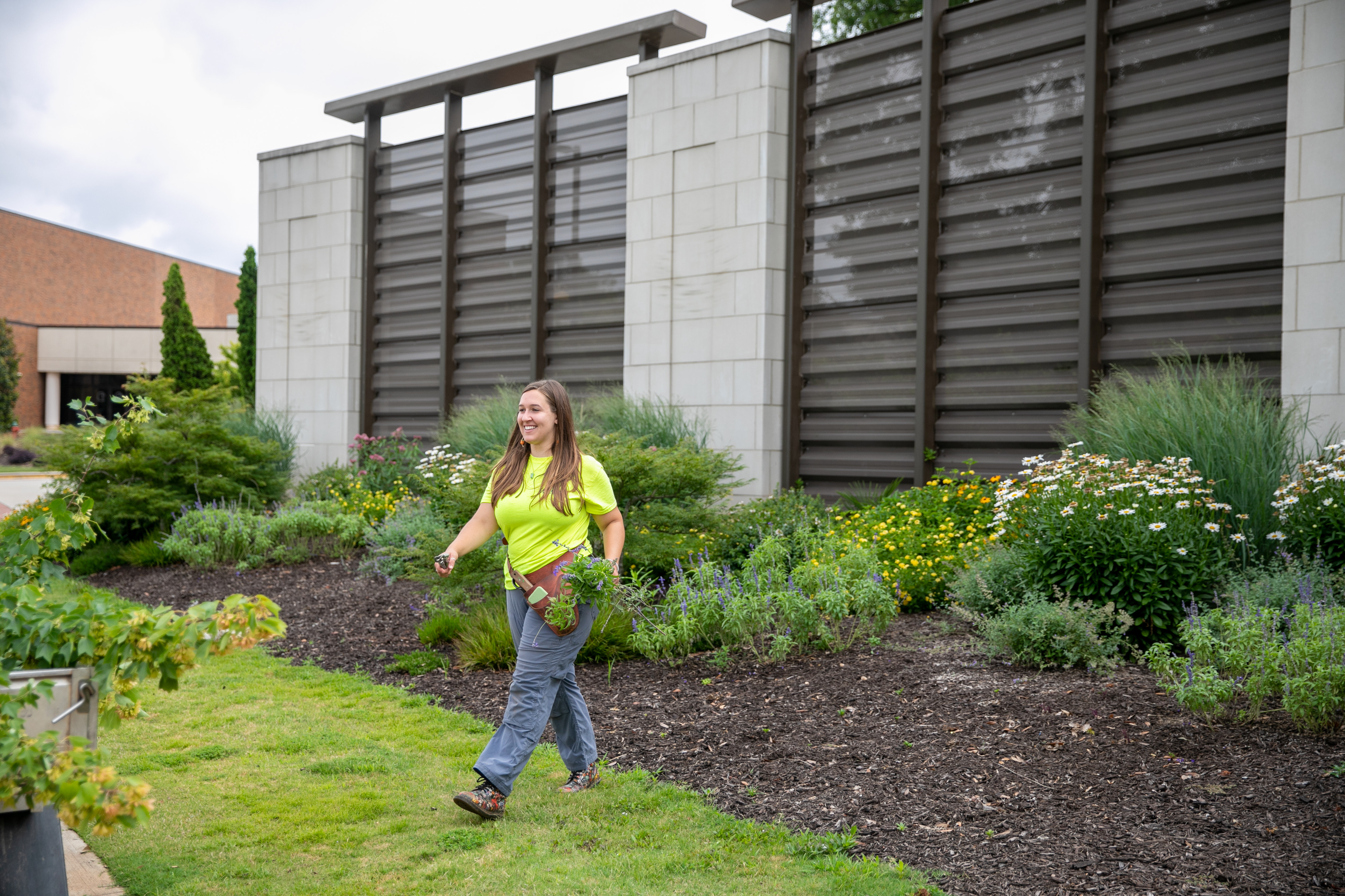 Karla Coffey working in a garden bed